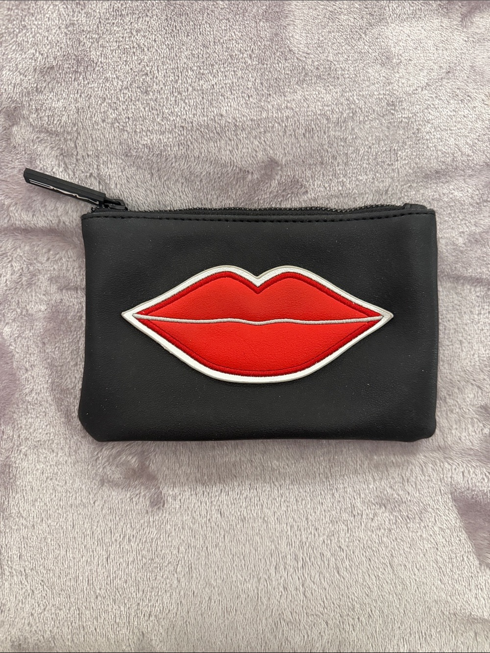 Black makeup pouch with lipstick design